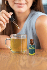 Woman adding KeySlim drops to her tea